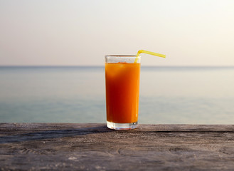 Orange juice on the beach