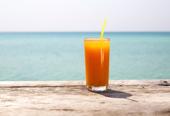 Orange juice on the beach