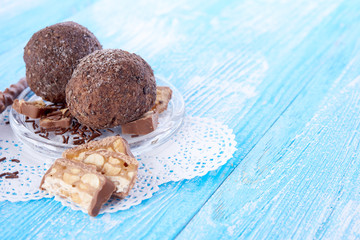 Cupcake with chocolate on wooden background