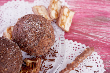 Cupcake with chocolate on wooden background