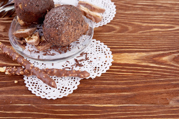 Cupcake with chocolate on wooden background
