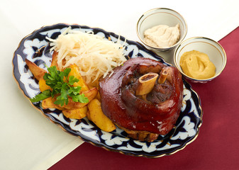 Meat on a grill with vegetables