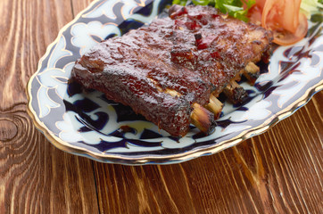 Meat on a grill with vegetables