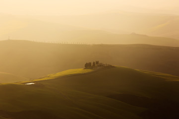 Farmland near Volterra, rolling hills on sunset. Rural landscape