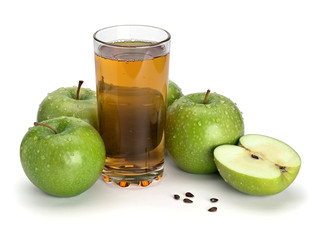 Three green apples and juice glass