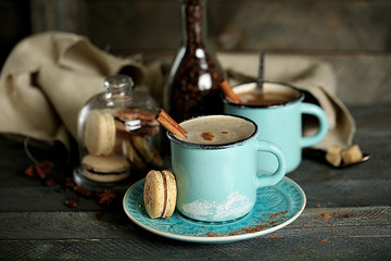 Fototapeta na wymiar Tasty cappuccino on wooden table