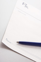 A blue pen on a rx prescription