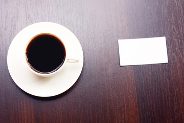 A blank and a cup of coffee viewed from above