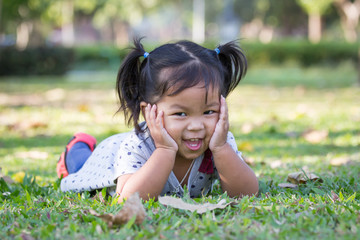 Cute little girl is playing in the park