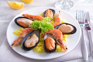 Seafood Paella on plate on table close-up