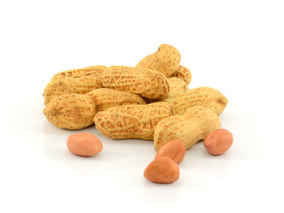 Dried peanuts in closeup on white background
