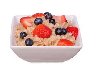 Oatmeal with berries isolated on white