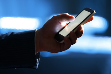 Male hand touching screen phone close-up