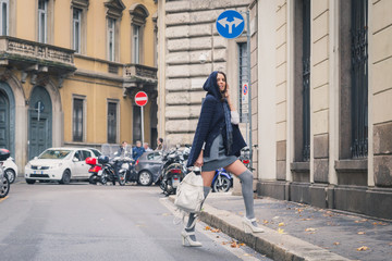 Fototapeta premium Beautiful girl posing in the city streets