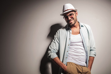 Smiling young fashion man looking at the camera