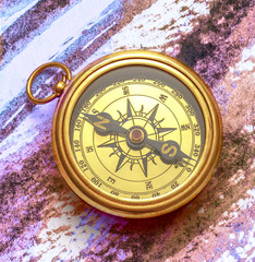 Vintage compass on abstract watercolor painting