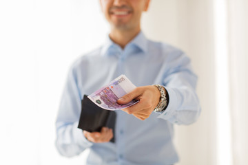 close up of businessman hands holding money