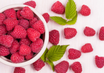 Raspberry superfood in a bowl on a white background