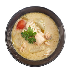 Top view of Thai food - chicken and galangal in coconut milk sou