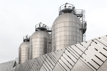 Three silos in stainless steel
