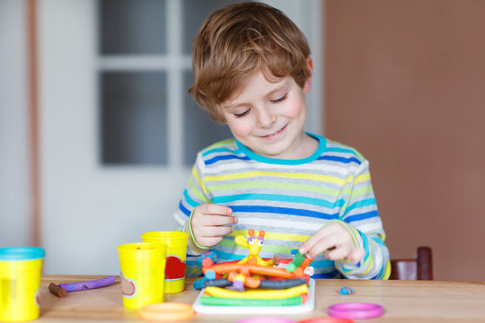 Happy Little Child, Adorable Creative Kid Boy Playing With Dough