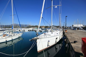 Fototapeta premium Yachts and sail boats reflected in a Marina harbour