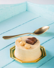 Small cake with hazelnuts and chocolate heart.