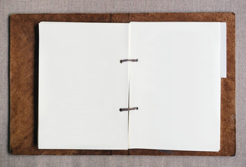 Blank paper page in leather cover folder