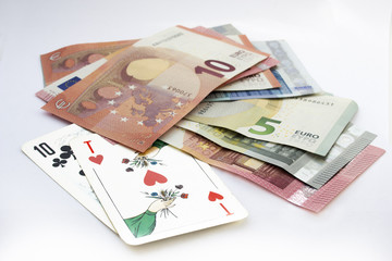 Playing cards and euro currency