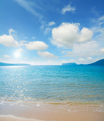 Mugoni beach under a cloudy sky