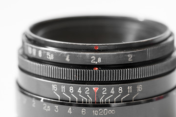 Vintage photo camera lens close up showing aperture 2.8