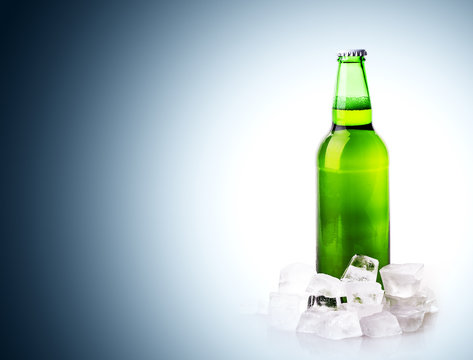 beer bottle in ice cubes