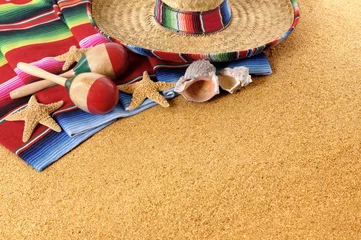 Poster Mexican beach sand background with sombrero serape rug or blanket photo horizontal © david_franklin