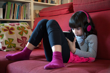 Little girl using tablet pc