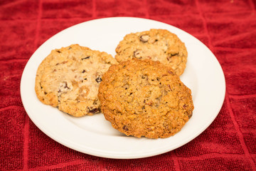 Three Cookies on White Plate and Red Towel