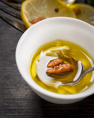 bowl with spice oil, chili  and lemon