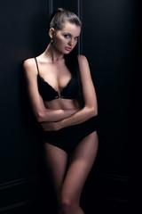 Fototapeta na wymiar Portrait of a sexy woman in black lingerie, fashion shoot