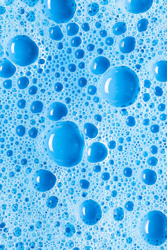 Blue soap with bubbles and reflections