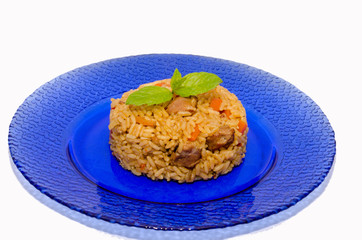 pilaf on a blue plate and isolated background