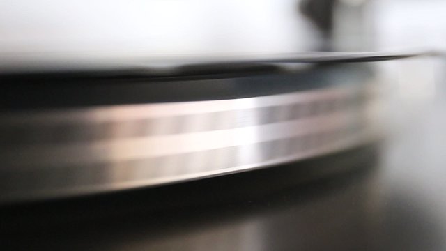 running old gramophone turntable with black disc
