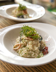 Risotto with seafood served on plate