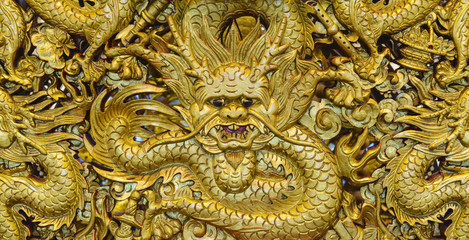 Fototapeta premium Golden dragon sculpture carving