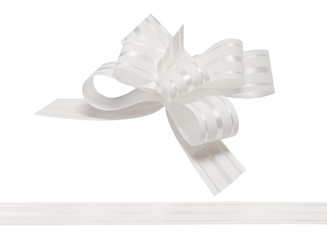 Shiny white satin ribbon on white background
