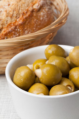Stuffed green olives and bread.