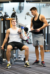 Fototapeta na wymiar man exercising on gym machine