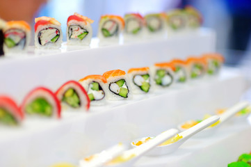 Delicious sushi with avocado topping