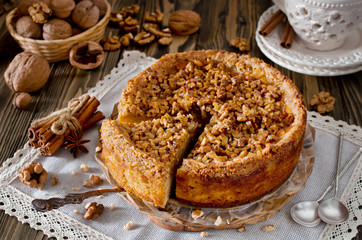 Piece of apple pie with walnut and sugar glaze