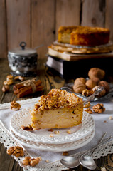 Piece of apple pie with walnut and sugar glaze