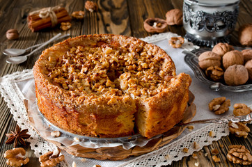 Piece of apple pie with walnut and sugar glaze