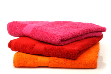 colorful stacked bathroom towels on a white background